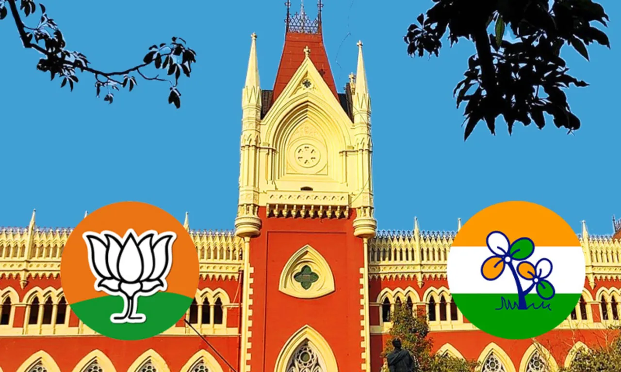 Red-brick Gothic-style building with a blue sky, featuring two large circular political logos in the foreground: BJP lotus on the left and Congress on the right.
